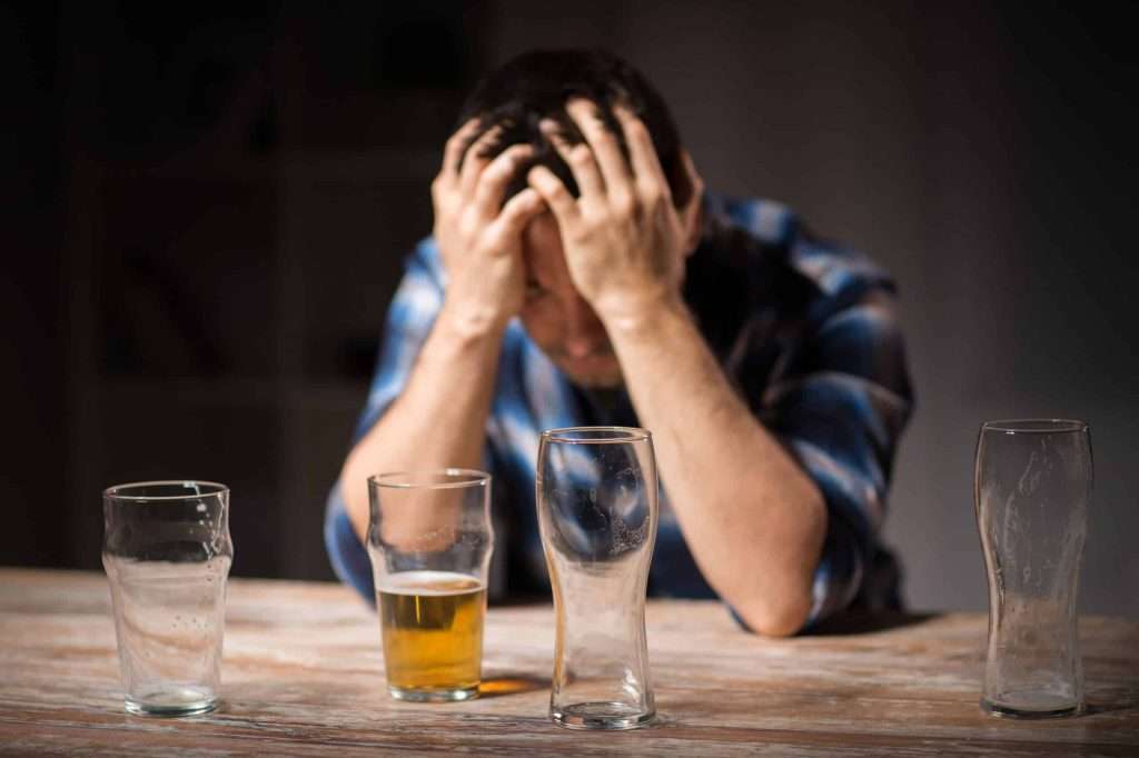 Man Struggling with alcohol addiction wondering does alcohol rehab work