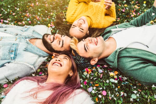 Friends lying on the ground after getting treatment by being measured on the Addiction Severity Index.