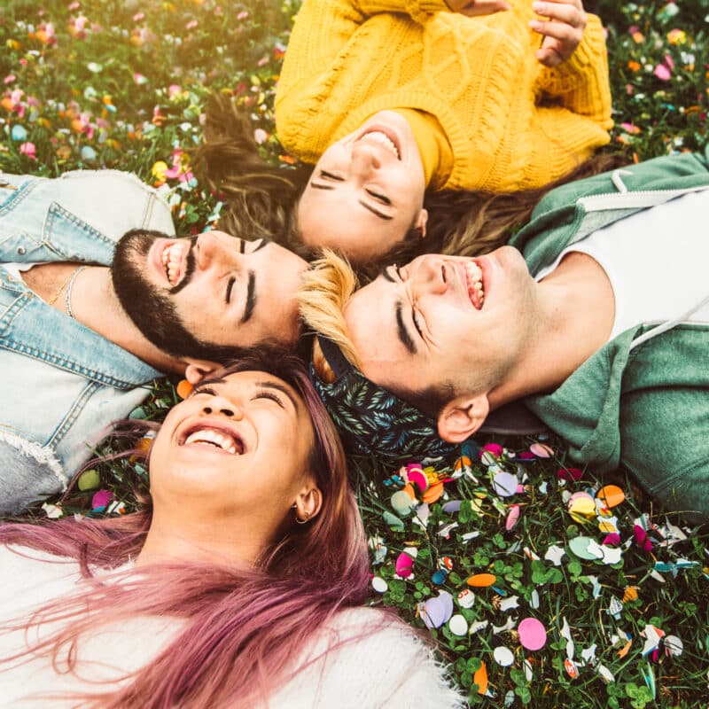 Friends lying on the ground after getting treatment by being measured on the Addiction Severity Index.