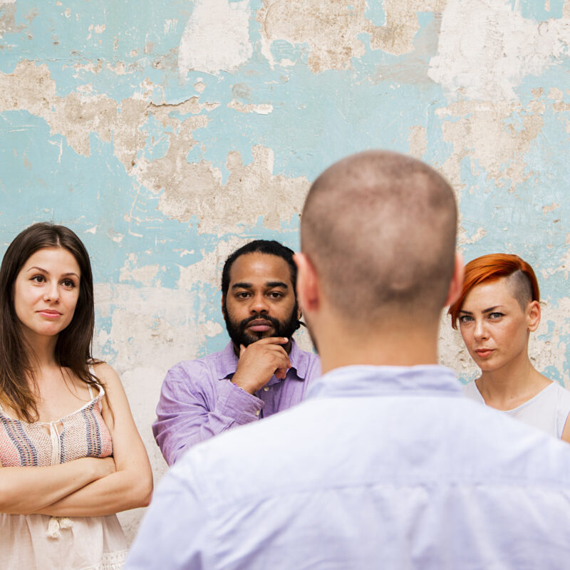 Three people asking a head in the foreground "How to stop drinking".